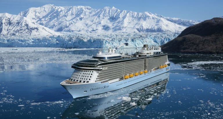 Ovation of the seas in alaska with North Star raised and glacier in the background
